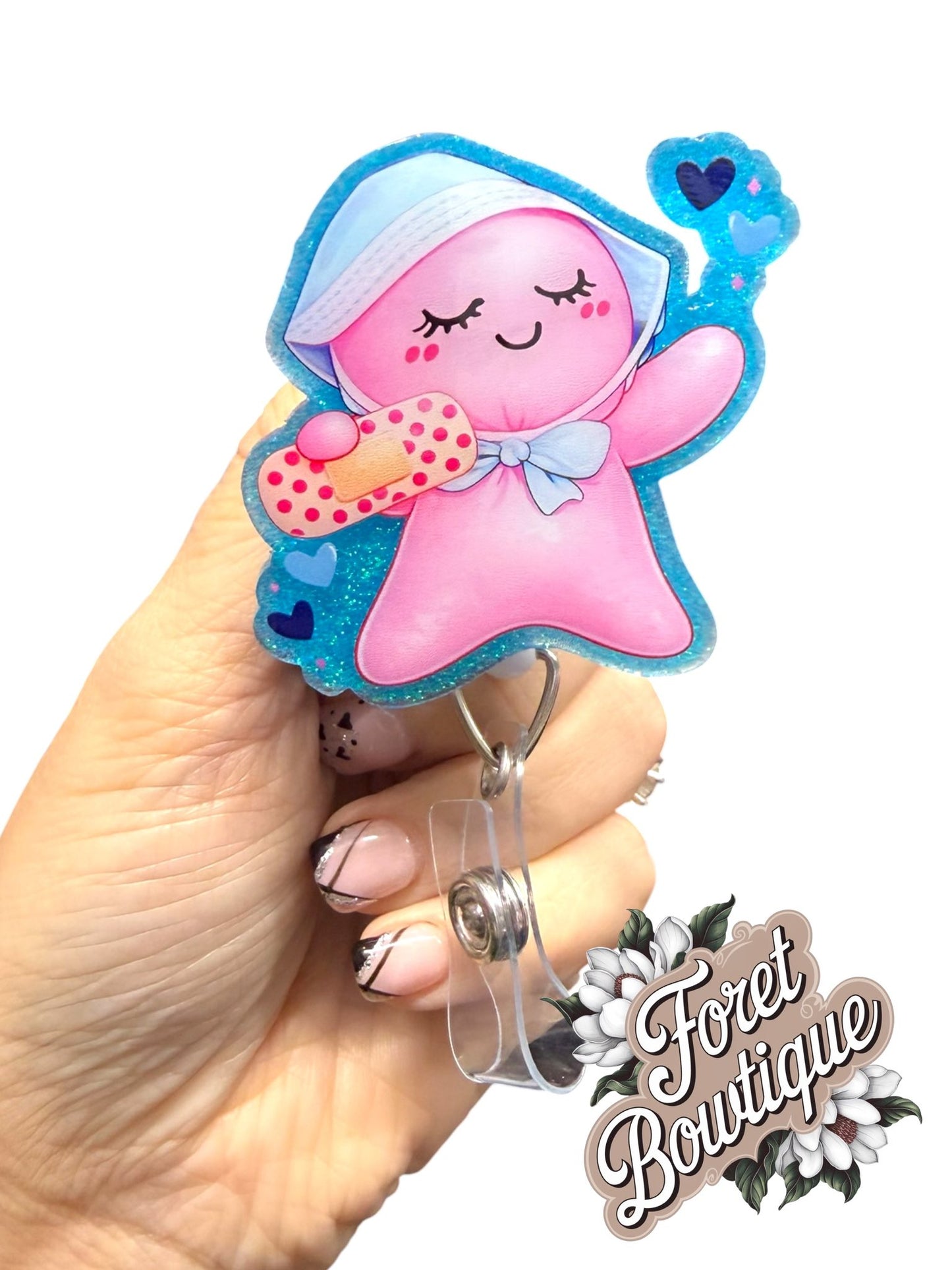 Pink Glove baby holding bandage